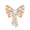 Large golden bow - brooch decorated with zircons and pearls
