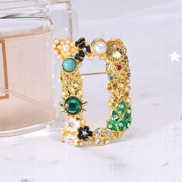 Letter D golden brooch pendant