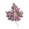 Golden leaf brooch with zircons