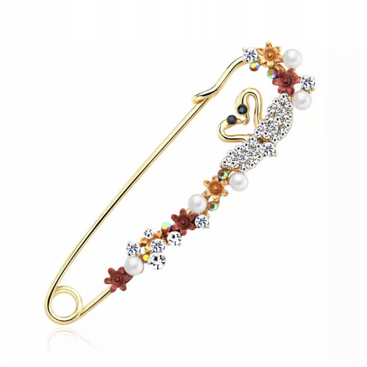 Swans with flowers, safety pin brooch with zircons