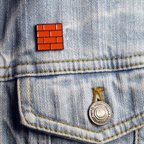 Brick from famous video game enamel pin