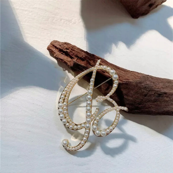 Golden letter B brooch with pearls