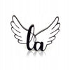 Little Angel enamel pin in the shape of wings with the LA logo