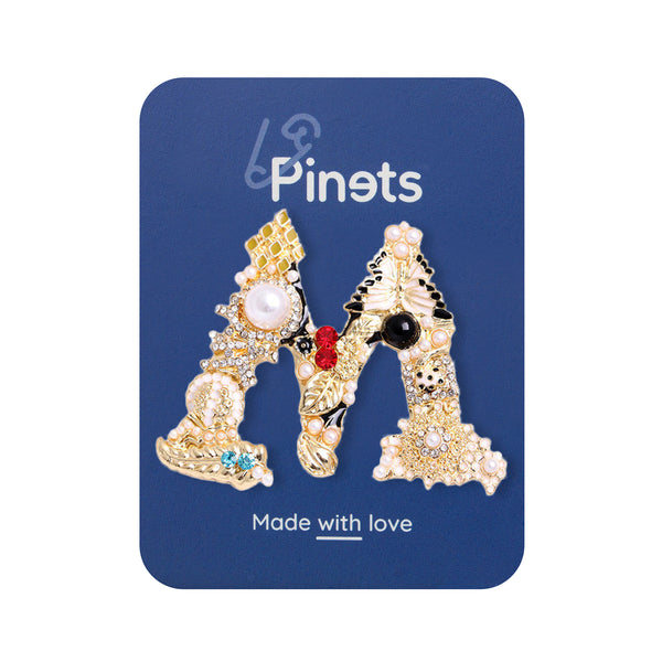Letter M golden brooch