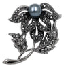 Flower brooch with zircons and pearl