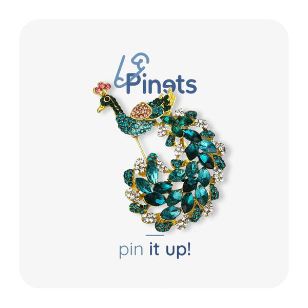 Turquoise peacock brooch filled with zircons