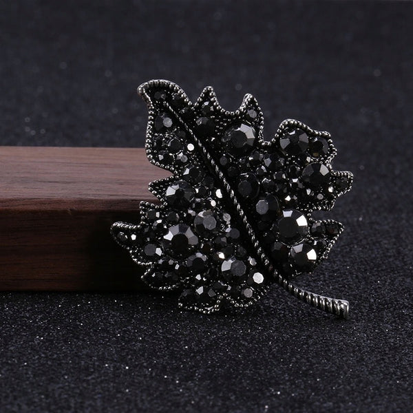 Silver leaf brooch with zircons