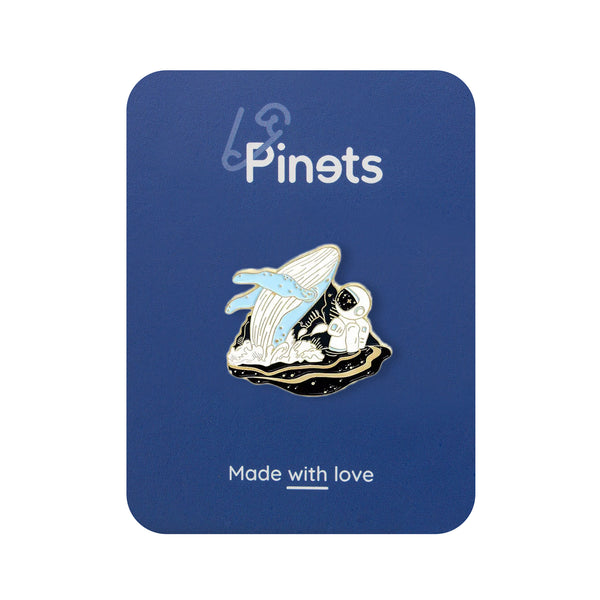 Whale and astronaut enamel pin