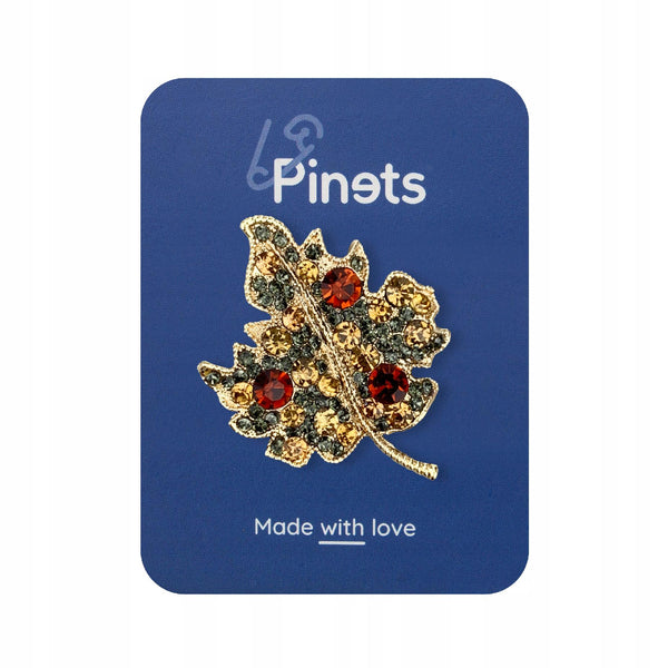 Golden leaf brooch with zircons