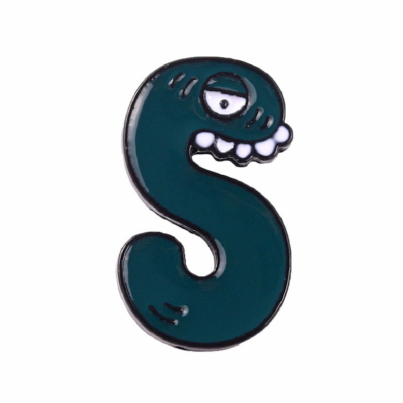 Letter S with an eye and teeth - dark green enamel pin