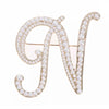 Golden letter N brooch with pearls