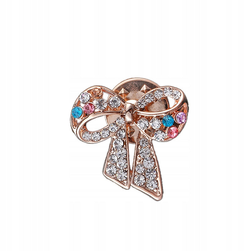 Bow pin with zircons in the ribbon shape